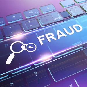 Keyboard with spacebar that says 'fraud'. Magnifying glass and lock symbols are placed next to the word. To indicates invoice fraud prevention.