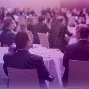 Image features people in business dress seated at tables, cabaret-style, signifying the Finance Directors Forum