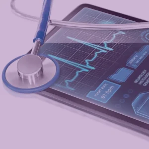 A stethoscope rests on a device showing a heart rate and other vitals. This image is to support a blog around the NEP conference, which supports the NHS